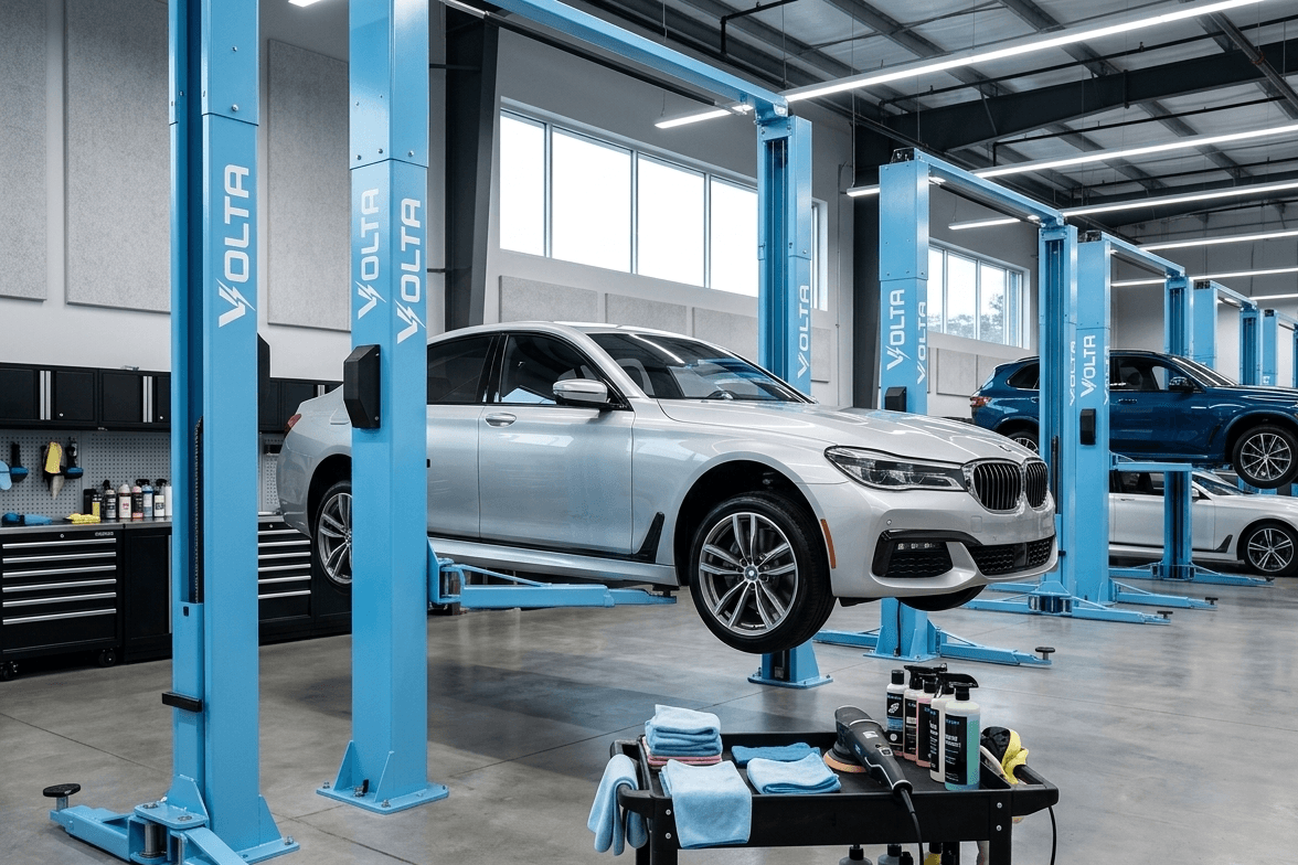 Cars on lifts in a Volta service bay